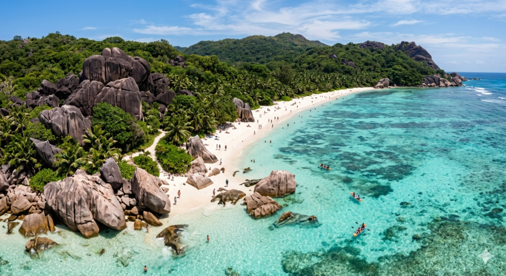 The Anti-Bucket List: 10 Destination Dupes to Visit in 2026, featuring a scenic tropical beach with granite mountains and turquoise water.