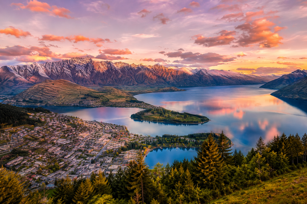 Queenstown New Zealand at golden hour with Lake Wakatipu and the Remarkables mountain range — the adventure travel hub at the centre of any custom travel planning guide for the South Island