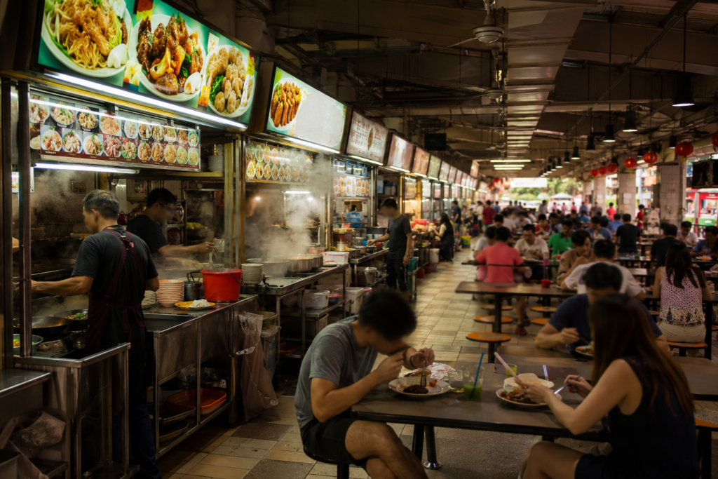 Singapore on a budget — hawker centre food stalls representing the city's authentic, budget-friendly dining culture