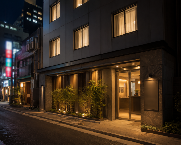 Tokyo on a budget — business hotel exterior representing an affordable, comfortable accommodation strategy