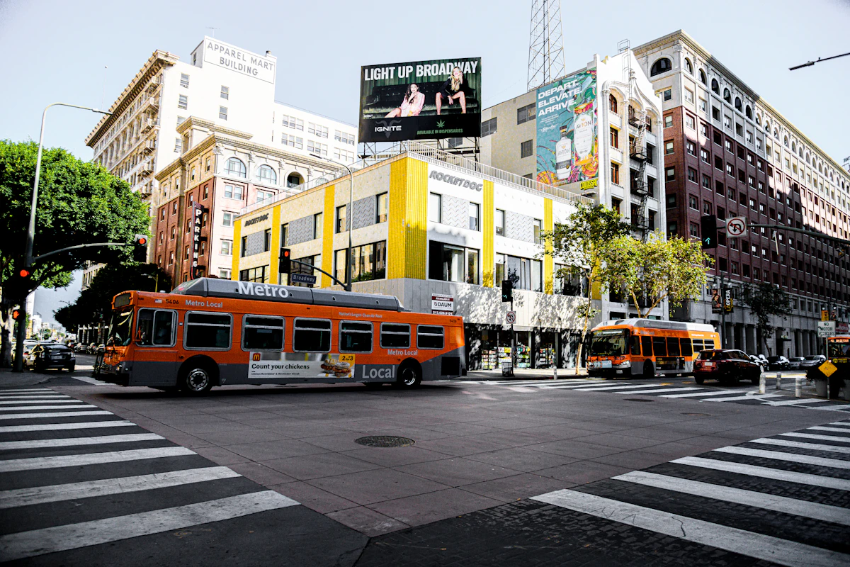 Orange Metro buses at a downtown Los Angeles intersection