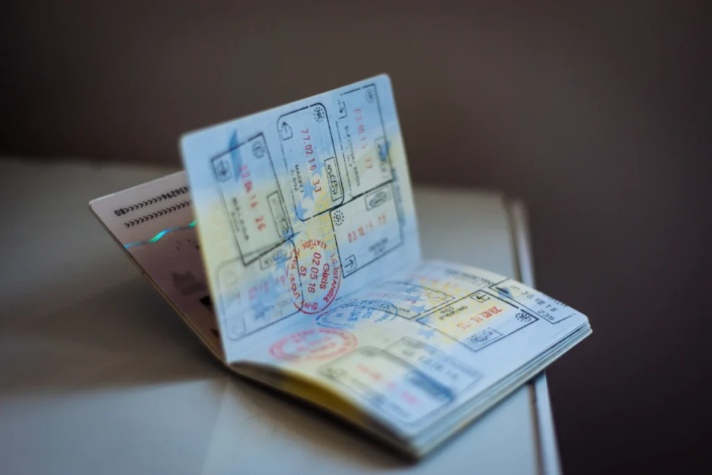 Open passport with travel stamps on a table