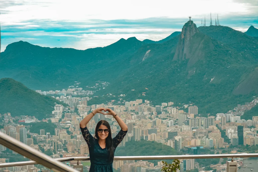 Woman at a viewpoint overlooking Rio de Janeiro and Corcovado